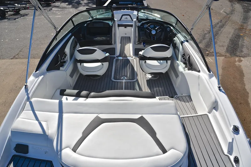 Slide: The Image of 2018 Monterey 204 FS boat interior with sleek seating and modern dashboard. - 18