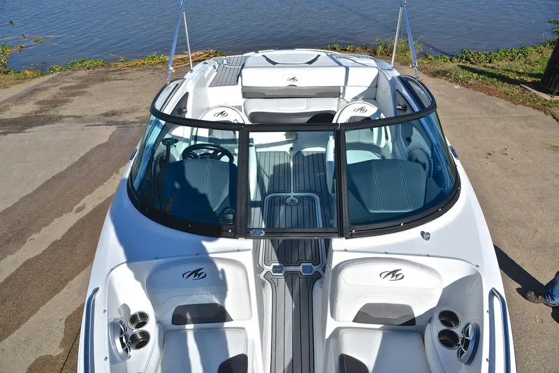 Slide: The Image of 2018 Monterey 204 FS boat with sleek design, docked by the water. - 20