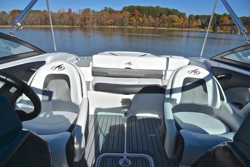 Slide: The Image of 2018 Monterey 204 FS boat interior with lake view and autumn foliage. - 22