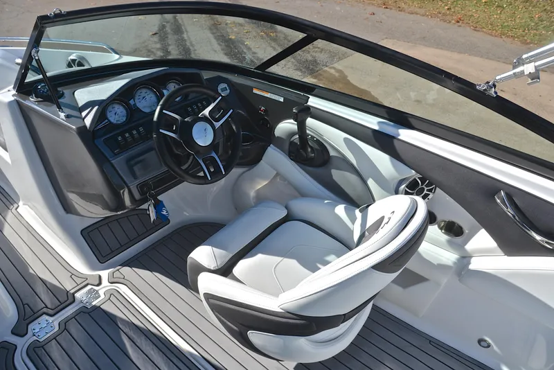 Slide: The Image of 2018 Monterey 204 FS boat interior with steering wheel and dashboard. - 24