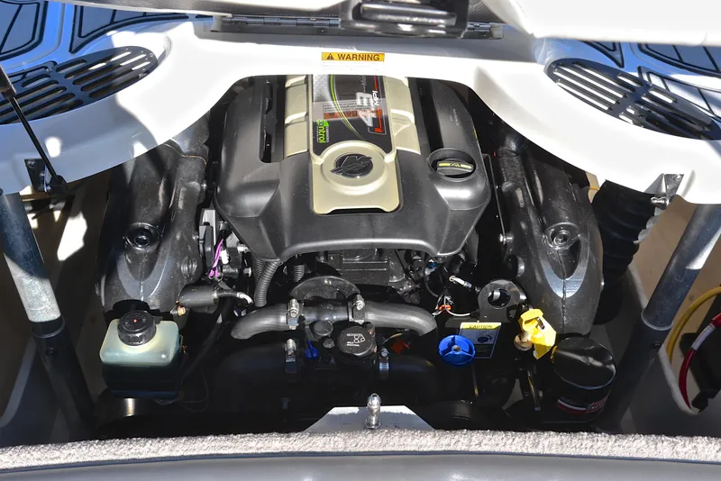 Slide: The Image of 2018 Monterey 204 FS boat engine compartment, showcasing a powerful inboard motor. - 27