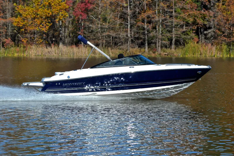 Slide: The Image of 2018 Monterey 204 FS boat cruising on a lake with autumn trees in the background. - 3