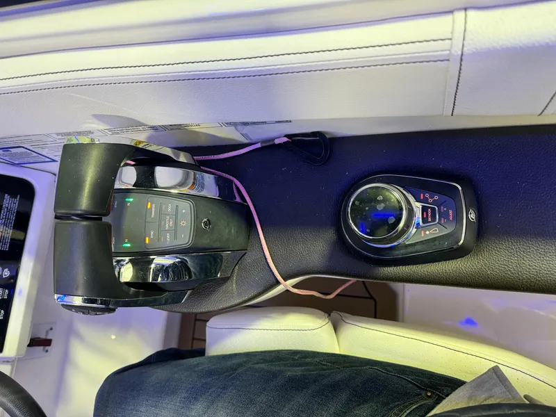 Slide: The Image of Helm of 2019 Sea Ray Sundancer 320 with Simrad navigation displays and controls. - 12