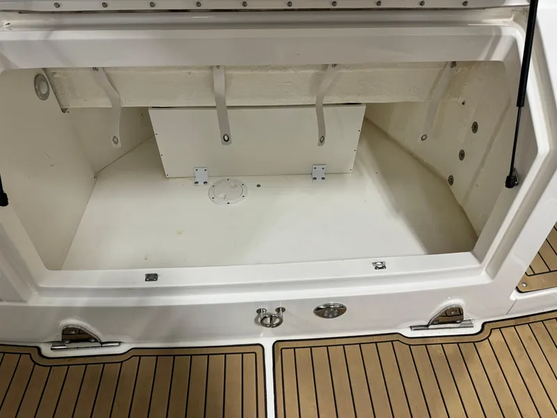 Slide: The Image of 2019 Sea Ray Sundancer 320 interior with elegant seating and table, showroom view. - 15