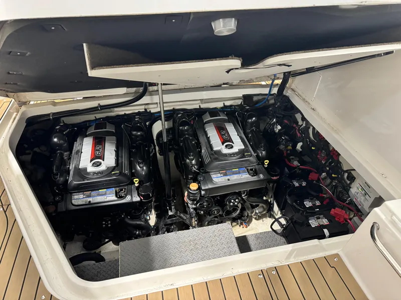 Slide: The Image of Interior of 2019 Sea Ray Sundancer 320 yacht, featuring modern seating and a mounted TV. - 19