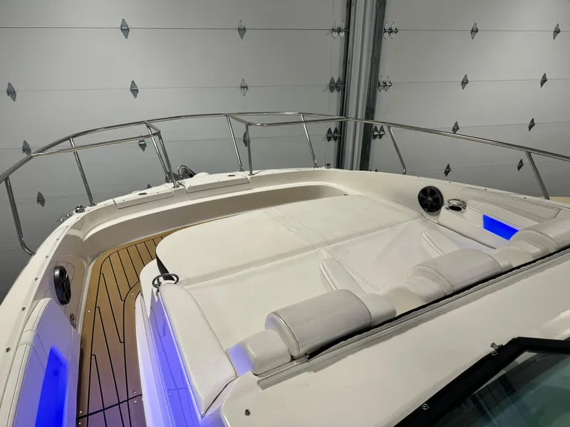 Slide: The Image of 2019 Sea Ray Sundancer 320 yacht in a spacious indoor storage facility. - 6