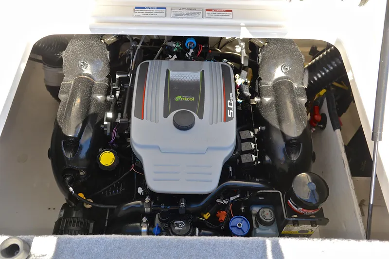 Slide: The Image of 2015 Bayliner 195 boat engine compartment with 5.0L motor. - 27