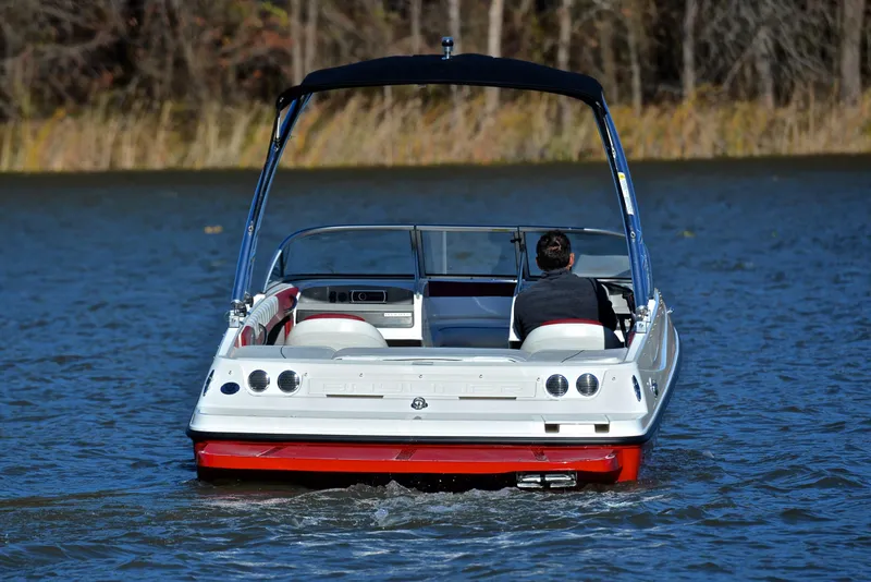 Slide: The Image of 2015 Bayliner 195 boat cruising on a calm lake. - 8