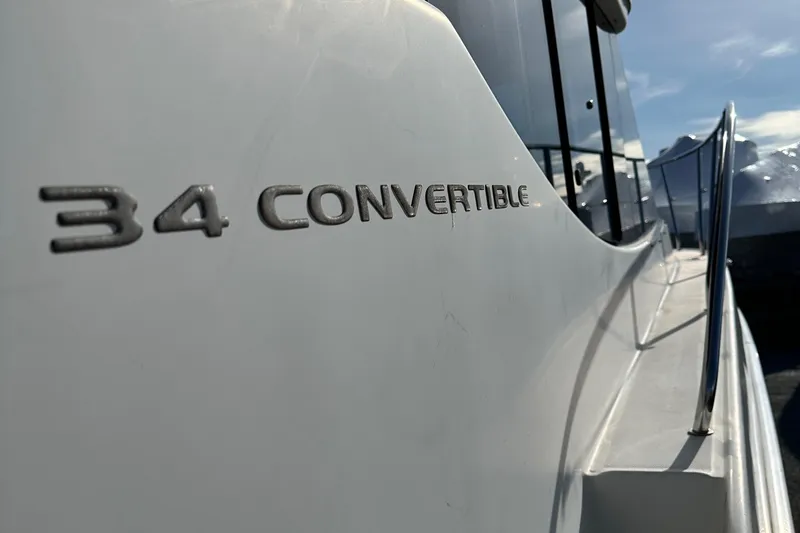 Slide: The Image of 2005 Silverton 34 Convertible boat side view with model name visible. - 10