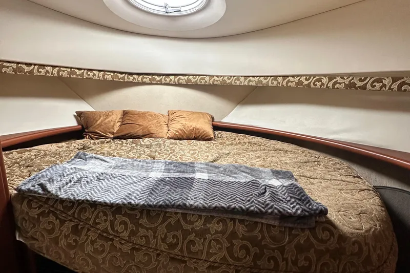 Slide: The Image of Luxurious cabin interior of 2005 Silverton 34 Convertible yacht with cozy bedding. - 22