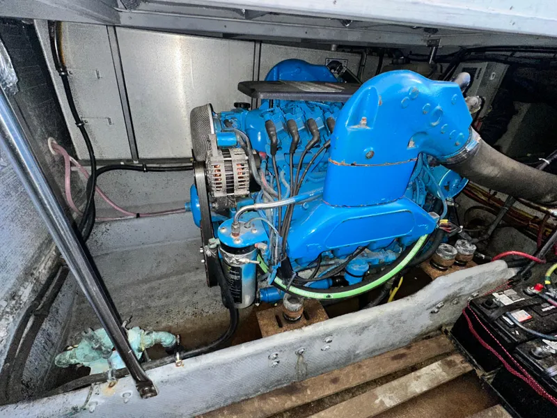 Slide: The Image of Engine compartment of a 2005 Silverton 34 Convertible boat, featuring a blue engine. - 28