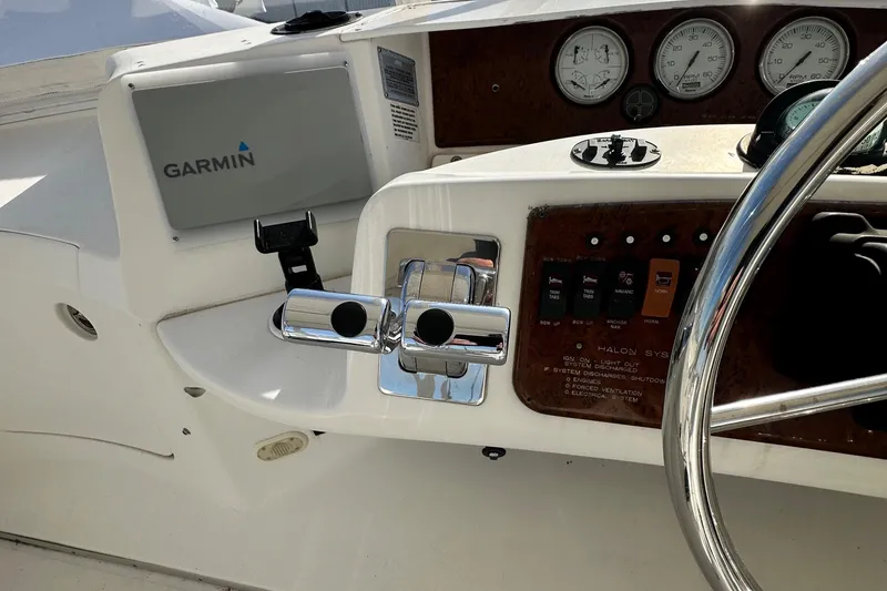 Slide: The Image of 2005 Silverton 34 Convertible boat dashboard with Garmin GPS and control panel. - 4