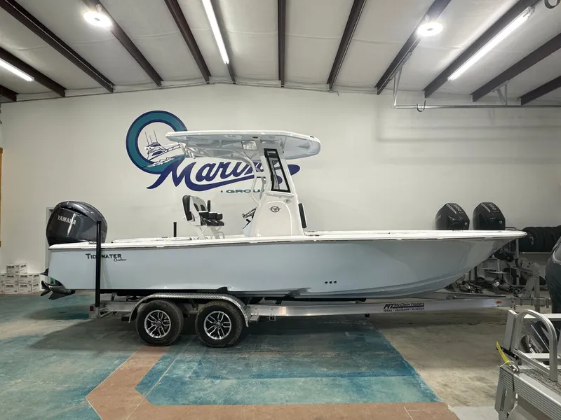 Slide: The Image of 2025 Tidewater 2500CB boat on trailer in showroom with Yamaha engine. - 1