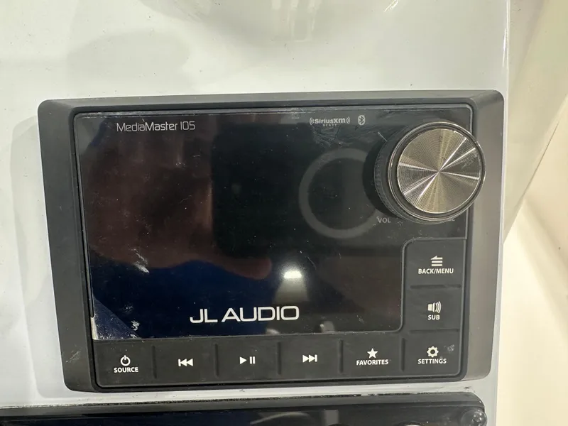 Slide: The Image of JL Audio MediaMaster 105 control panel on 2025 Tidewater 2500CB boat. - 12
