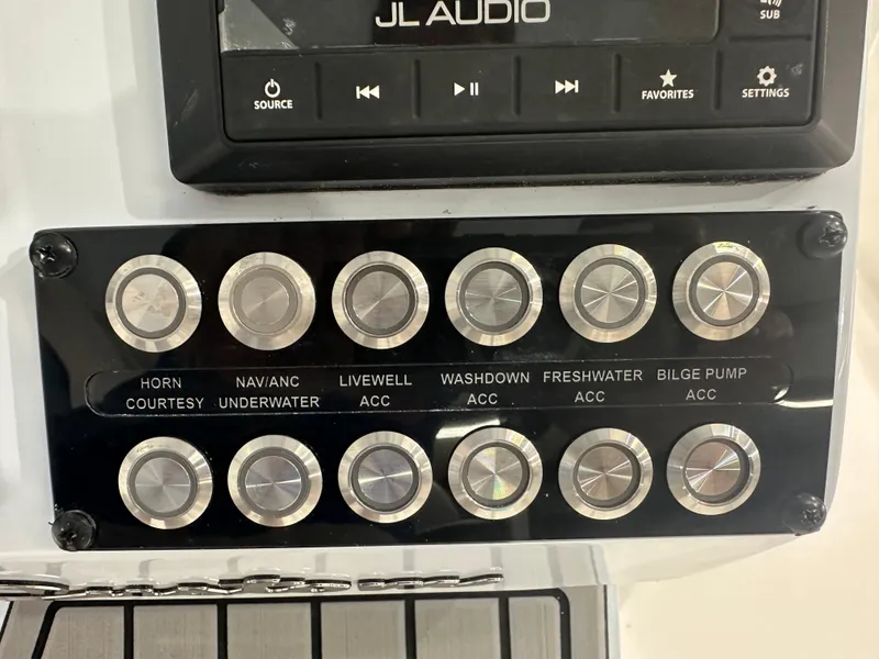 Slide: The Image of Control panel of 2025 Tidewater 2500CB boat with JL Audio system. - 13