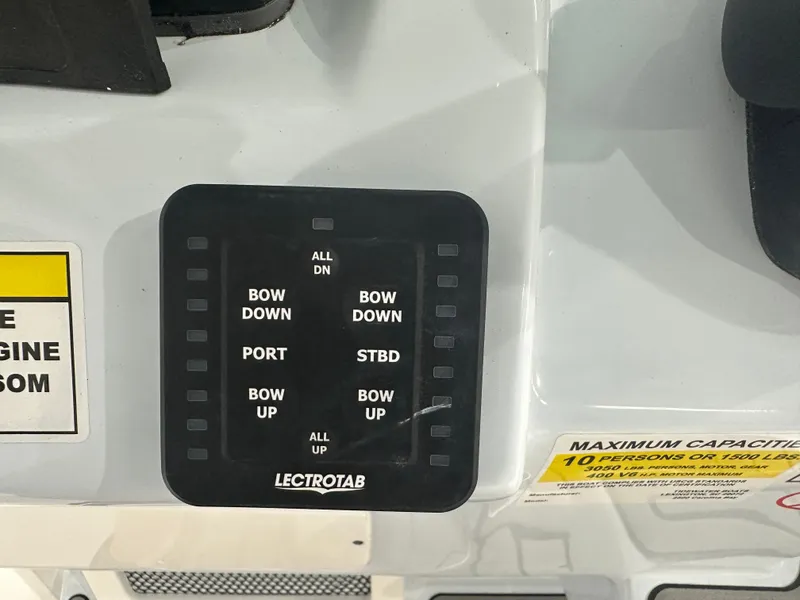 Slide: The Image of Control panel on 2025 Tidewater 2500CB boat with capacity warning label. - 15