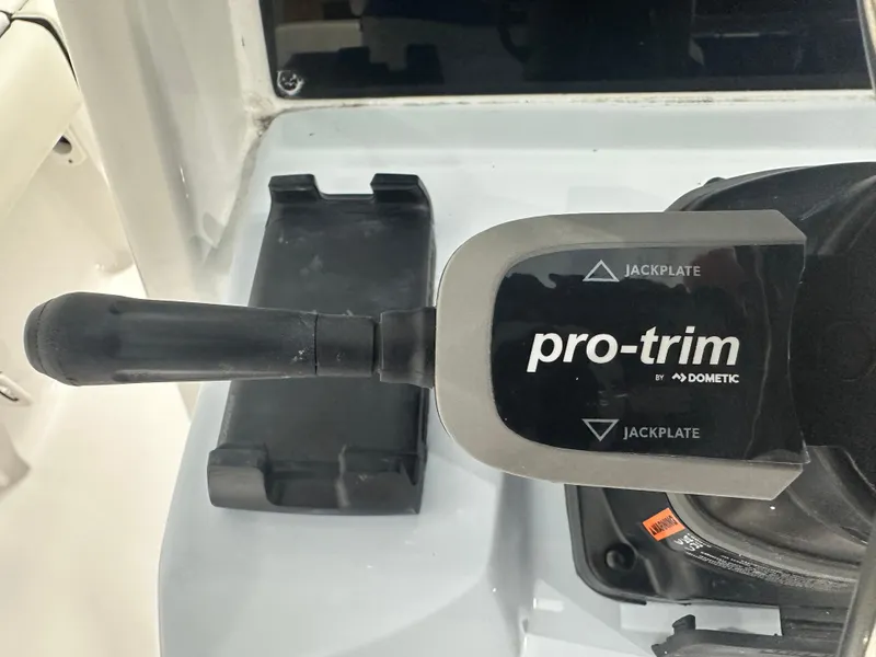 Slide: The Image of Pro-trim control lever on 2025 Tidewater 2500CB boat by Dometic. - 17