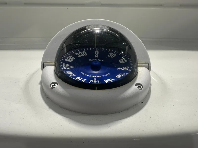 Slide: The Image of Ritchie Powerdamp Plus compass on 2025 Tidewater 2500CB boat dashboard. - 21
