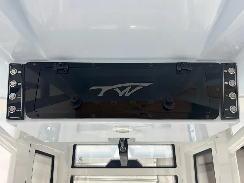 Slide: The Image of Control panel of 2025 Tidewater 2500CB boat with switches and logo. - 22