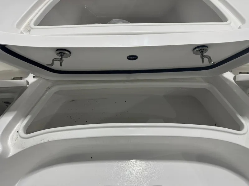 Slide: The Image of Open storage compartment of 2025 Tidewater 2500CB boat. - 25