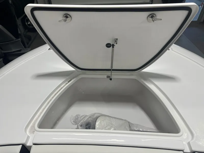 Slide: The Image of Open storage compartment on 2025 Tidewater 2500CB boat. - 27