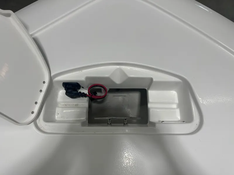 Slide: The Image of 2025 Tidewater 2500CB boat storage compartment with cables and open hatch. - 29