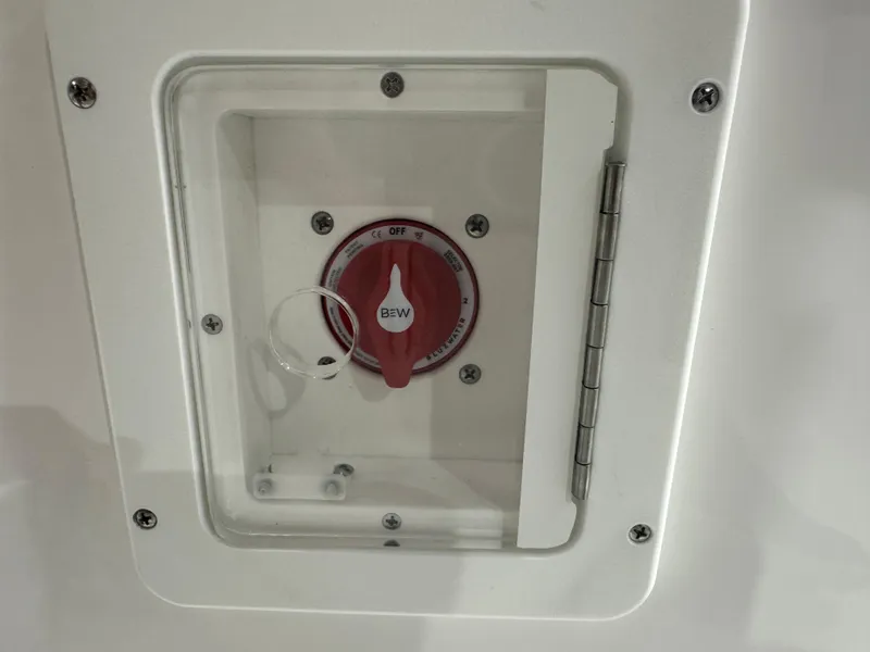 Slide: The Image of Battery switch panel on 2025 Tidewater 2500CB boat, featuring a red control knob. - 31