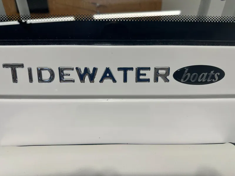 Slide: The Image of Tidewater 2500CB 2025 boat logo on white surface. - 32
