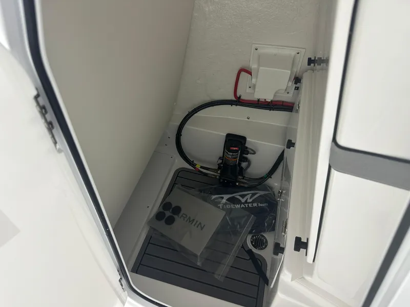 Slide: The Image of Interior view of 2025 Tidewater 2500CB boat compartment with Garmin equipment. - 33