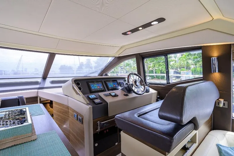 Slide: The Image of Luxurious 2016 Azimut 50 yacht interior with modern helm and navigation controls. - 39