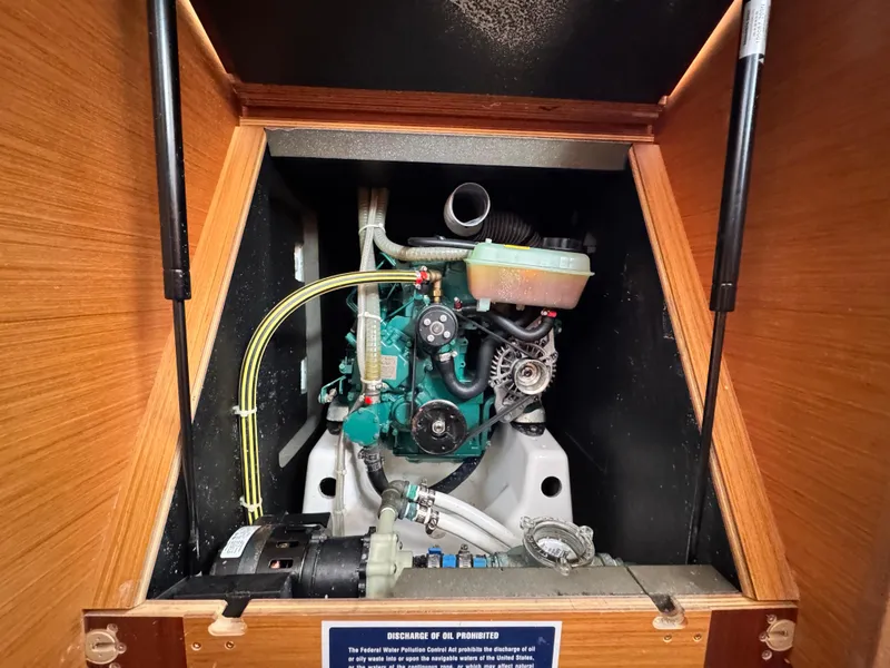 Slide: The Image of Engine compartment of a 2021 Dufour 360 sailboat, showcasing mechanical components. - 13
