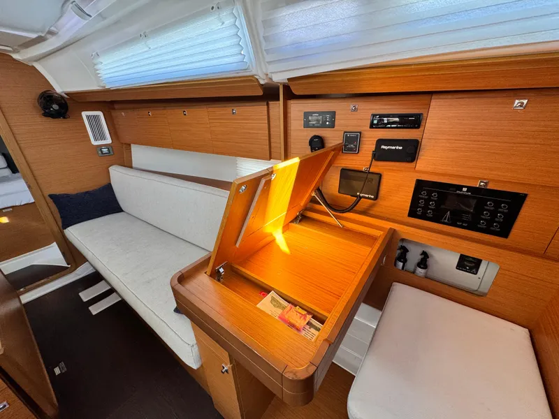 Slide: The Image of Interior of 2021 Dufour 360 yacht with wooden finish and navigation station. - 16