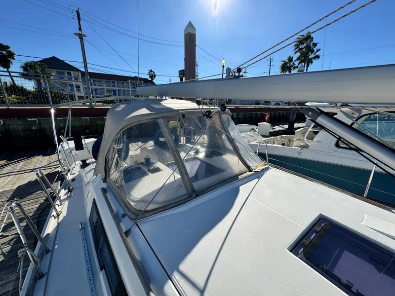 Slide: The Image of 2021 Dufour 360 sailboat docked under clear blue sky. - 19