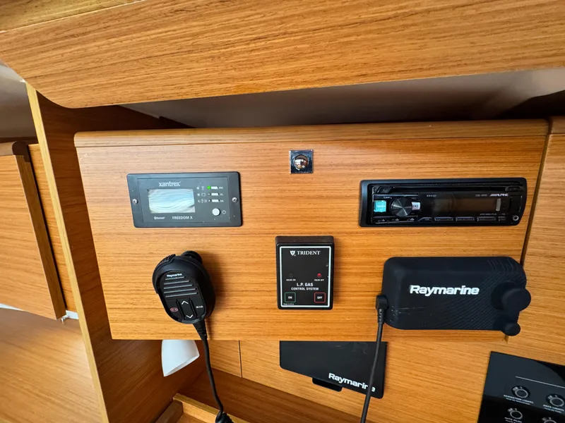 Slide: The Image of Control panel of 2021 Dufour 360 yacht with navigation and communication equipment. - 8