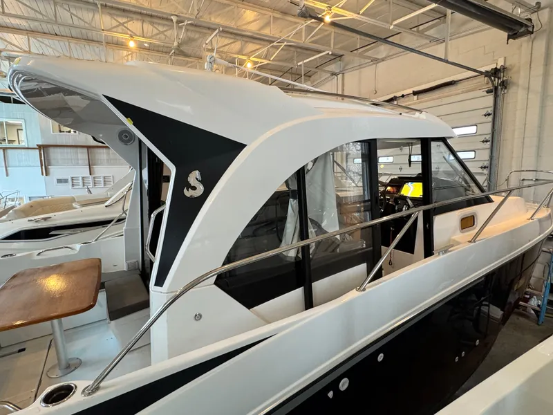 Slide: The Image of 2022 Beneteau Antares 9 boats displayed in a showroom. - 3