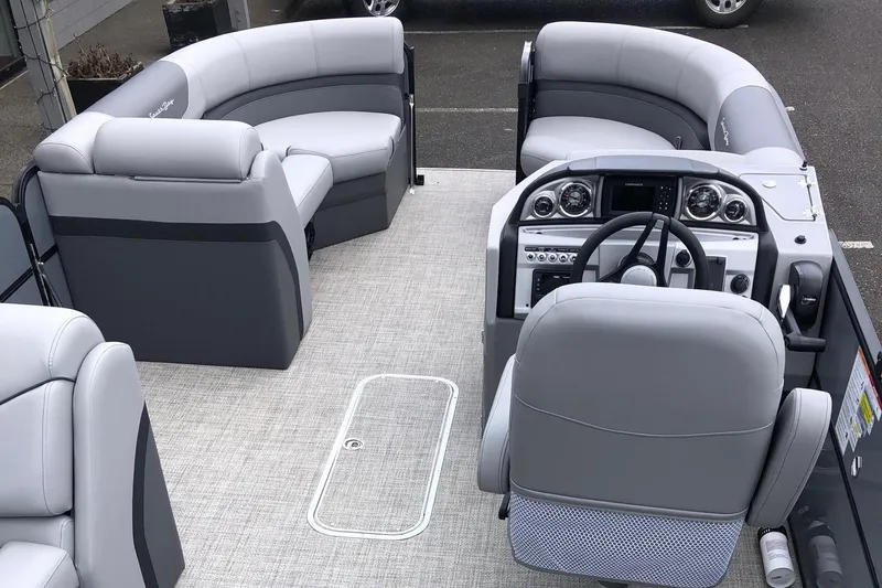 Slide: The Image of 2023 South Bay 222CR LE 2.75 pontoon boat interior with gray seating and modern dashboard. - 4