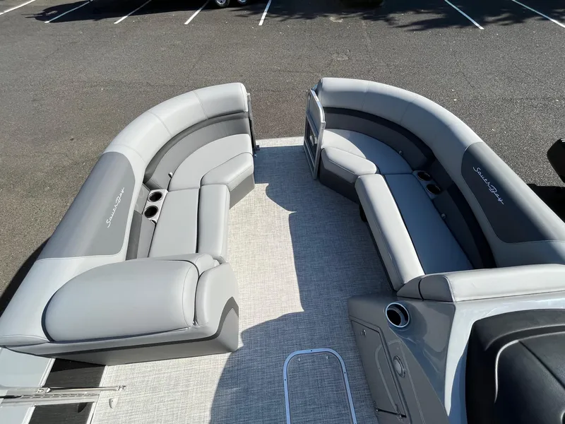 Slide: The Image of 2023 South Bay 222CR LE 2.75 pontoon boat with gray seating and spacious layout. - 7