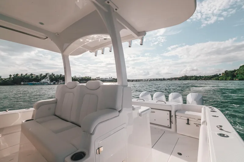 Slide: The Image of 2021 HCB 42 Lujo boat interior with seating, ocean view, and clear sky. - 3