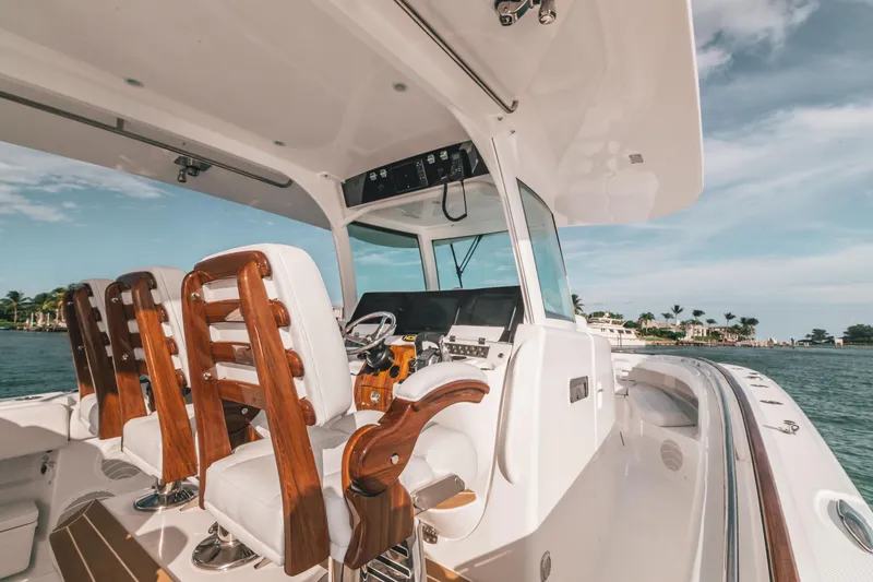 Slide: The Image of 2021 HCB 42 Lujo boat interior with luxurious seating and helm, ocean view. - 5