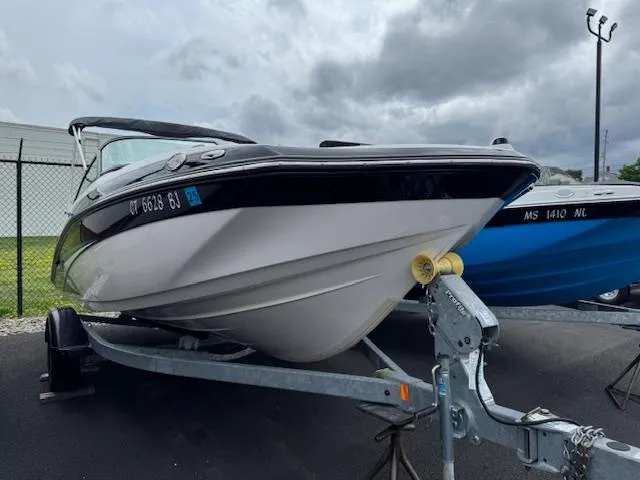 Slide: The Image of 2017 Yamaha Boats SX195 on trailer, parked outdoors under cloudy sky. - 1