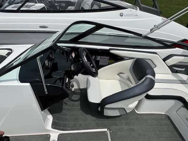 Slide: The Image of 2017 Yamaha Boats SX195 interior with steering wheel and seating. - 11