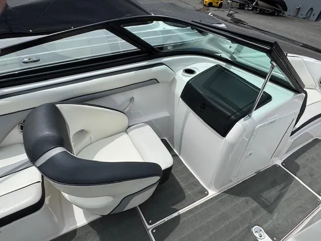 Slide: The Image of 2017 Yamaha Boats SX195 interior with sleek seating and modern dashboard design. - 13