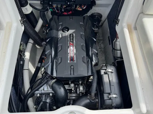 Slide: The Image of Engine compartment of a 2017 Yamaha Boats SX195, showcasing the powerful motor and components. - 19