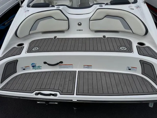 Slide: The Image of 2017 Yamaha Boats SX195 swim platform with cushioned seating and non-slip decking. - 20