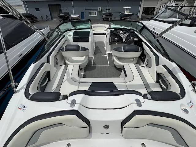 Slide: The Image of 2017 Yamaha Boats SX195 interior with sleek seating and modern dashboard. - 5