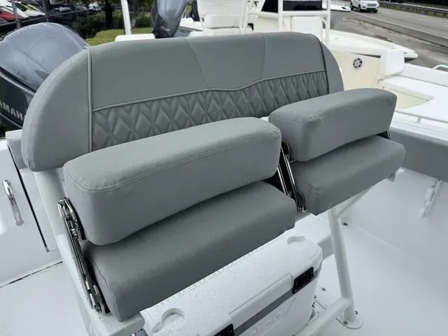 Slide: The Image of 2025 Wellcraft 223 Fisherman boat seating with gray cushioned seats and backrest. - 10