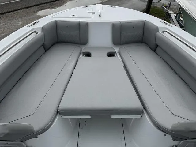 Slide: The Image of 2025 Wellcraft 223 Fisherman boat interior with gray cushioned seating. - 14
