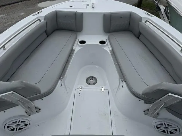 Slide: The Image of 2025 Wellcraft 223 Fisherman boat interior with gray seating and cup holders. - 15