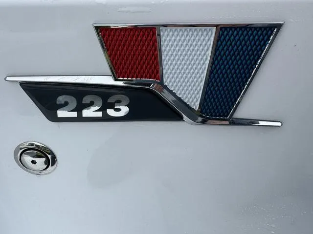 Slide: The Image of 2025 Wellcraft 223 Fisherman emblem with red, white, and blue accents. - 4