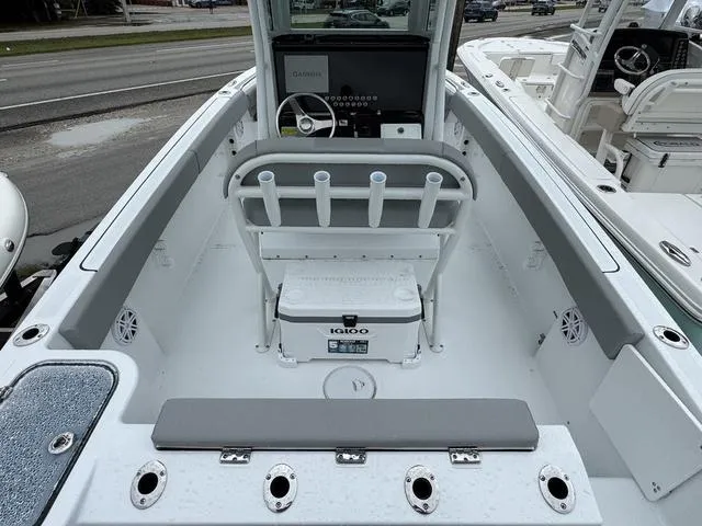 Slide: The Image of 2025 Wellcraft 223 Fisherman boat interior with seating and Igloo cooler. - 5